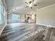 Spacious open floor plan connects the living room with the kitchen and provides ample light at 1397 Fern Ridge Ct # 34, Norcross, GA 30093