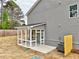 Cozy screened-in porch with white frame, concrete floors, and a view of the backyard at 1397 Fern Ridge Ct # 34, Norcross, GA 30093