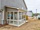 Covered back porch featuring white frames, concrete floors, and an open view at 1397 Fern Ridge Ct # 34, Norcross, GA 30093