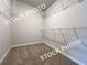 A carpeted walk-in closet with built-in shelving at 1397 Fern Ridge Ct # 34, Norcross, GA 30093