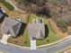 Aerial view showcases the home's rooftop, patio area, and manicured surroundings in a lovely neighborhood at 2096 Hamilton Lake Pkwy, Buford, GA 30519