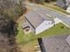 Aerial view displays the home's backyard with a charming outdoor dining area at 2096 Hamilton Lake Pkwy, Buford, GA 30519