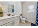 Cozy bathroom featuring a vanity, toilet and mirror at 2096 Hamilton Lake Pkwy, Buford, GA 30519