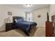 Relaxing bedroom featuring a comfortable bed, carpet flooring, and a modern ceiling fan at 2096 Hamilton Lake Pkwy, Buford, GA 30519
