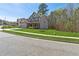 Manicured lawn with a two-story home featuring a convenient two car garage and inviting facade at 2096 Hamilton Lake Pkwy, Buford, GA 30519