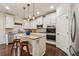 Modern kitchen featuring granite countertops, stainless steel appliances, and a central island at 2096 Hamilton Lake Pkwy, Buford, GA 30519