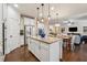 Spacious kitchen with granite island, stainless appliances, and open layout to the living area at 2096 Hamilton Lake Pkwy, Buford, GA 30519