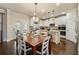 Bright eat-in kitchen boasts white cabinets, stainless steel appliances, island and hardwood floors at 2096 Hamilton Lake Pkwy, Buford, GA 30519