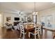 Open-concept living area features hardwood floors, a fireplace, and lots of natural light at 2096 Hamilton Lake Pkwy, Buford, GA 30519