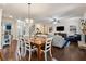 Open-concept living area features hardwood floors, a fireplace, and lots of natural light at 2096 Hamilton Lake Pkwy, Buford, GA 30519