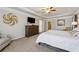 Bright main bedroom featuring neutral walls, carpet, tray ceiling and ensuite bathroom at 2096 Hamilton Lake Pkwy, Buford, GA 30519