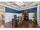 Elegant office space with coffered ceiling, hardwood floors, and built-in shelving at 2096 Hamilton Lake Pkwy, Buford, GA 30519