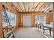 Unfinished basement area featuring exposed insulation and a ladder at 5615 Toccoa Dr, Douglasville, GA 30135