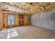 Unfinished basement with concrete walls and visible framework and insulation at 5615 Toccoa Dr, Douglasville, GA 30135