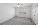 Neutral bedroom featuring a ceiling fan, a closet and a large window for natural light at 5615 Toccoa Dr, Douglasville, GA 30135