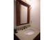 Bathroom vanity with wood cabinet, granite countertop and brushed chrome faucet fixture at 606 Se Riverview Dr # 606, Marietta, GA 30067