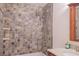 Bathroom featuring tub with tiled walls and brushed chrome shower head at 606 Se Riverview Dr # 606, Marietta, GA 30067