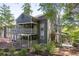 Inviting condo with outdoor living space, lush landscaping, and wood accents at 606 Se Riverview Dr # 606, Marietta, GA 30067