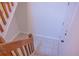 Staircase with tile landing and light walls at 606 Se Riverview Dr # 606, Marietta, GA 30067
