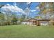 Sprawling backyard featuring a well-maintained lawn and a cozy screened-in porch, perfect for outdoor relaxation and entertainment at 814 Bank St, Smyrna, GA 30080