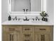 Bathroom with marble countertops and double sink vanity with an illuminated mirror at 814 Bank St, Smyrna, GA 30080