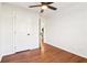 Hardwood floors, a ceiling fan, and white walls are featured in this bedroom at 814 Bank St, Smyrna, GA 30080