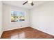 Bright bedroom with hardwood floors, ceiling fan, and a window providing natural light at 814 Bank St, Smyrna, GA 30080