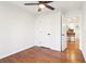 Bedroom featuring hardwood floors, a ceiling fan, and a door to the rest of the home at 814 Bank St, Smyrna, GA 30080