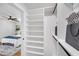 Walk-in closet featuring custom shelves, lighting, and bedroom view at 814 Bank St, Smyrna, GA 30080