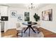 Charming dining area with a modern table, stylish chairs, and contemporary lighting at 814 Bank St, Smyrna, GA 30080