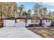 Charming ranch-style home with a brick facade, attached garage, and well-maintained front yard at 814 Bank St, Smyrna, GA 30080