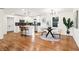 Open concept kitchen with white cabinets, stainless steel appliances, and an adjacent dining area at 814 Bank St, Smyrna, GA 30080