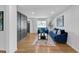Bright living room with hardwood floors, modern decor, and a stylish accent wall at 814 Bank St, Smyrna, GA 30080