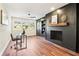 Open-concept living room with a desk and a brick fireplace at 814 Bank St, Smyrna, GA 30080