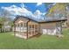 Inviting screened-in porch attached to a home with a garage, offering a serene space for enjoying the outdoors at 814 Bank St, Smyrna, GA 30080
