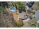 Expansive aerial view showcasing the house, pool, lush landscaping, and surrounding neighborhood at 1564 Beaver Creek Lane, Snellville, GA 30078