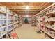Spacious unfinished basement with plenty of storage shelves and exposed ceiling at 1564 Beaver Creek Lane, Snellville, GA 30078