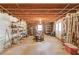 Unfinished basement with exposed framing, utilities, and potential for customization at 1564 Beaver Creek Lane, Snellville, GA 30078