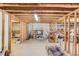 Unfinished basement with open layout, treadmill, exposed ceiling, and framing at 1564 Beaver Creek Lane, Snellville, GA 30078