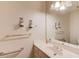 Bathroom features sink and vanity, decorative sconces, framed mirror, and a towel rack at 1564 Beaver Creek Lane, Snellville, GA 30078