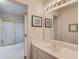 This bathroom features a large sink, shower and tub combo, and nice vanity lighting at 1564 Beaver Creek Lane, Snellville, GA 30078