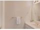 This bathroom features a white single sink vanity, gold fixtures, and a towel at 1564 Beaver Creek Lane, Snellville, GA 30078