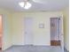 Bright bedroom has two doorways, neutral walls, standard ceiling fan, and carpeted floor at 1564 Beaver Creek Lane, Snellville, GA 30078