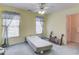 Bright bedroom with two windows and a ceiling fan, ready for personalization and comfortable living at 1564 Beaver Creek Lane, Snellville, GA 30078
