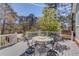 Outdoor deck showcases a table and chairs, perfect for al fresco dining with lovely wooded views at 1564 Beaver Creek Lane, Snellville, GA 30078
