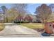 Beautiful brick home featuring a well-maintained yard and a winding driveway that adds to its charm at 1564 Beaver Creek Lane, Snellville, GA 30078