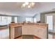 Kitchen boasts stainless steel appliances, white cabinetry, tile countertops, and breakfast bar seating at 1564 Beaver Creek Lane, Snellville, GA 30078