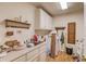 Functional laundry room with storage cabinets, sink, countertops, and washer hookups at 1564 Beaver Creek Lane, Snellville, GA 30078