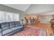 Open-concept living area with hardwood floors, fireplace, and eat-in kitchen featuring a breakfast bar and barstools at 1564 Beaver Creek Lane, Snellville, GA 30078