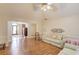 Spacious living room featuring hardwood floors, trim, and a view into the foyer and other living areas at 1564 Beaver Creek Lane, Snellville, GA 30078